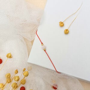 Ochranný náramek červený s pozlacenými korálky